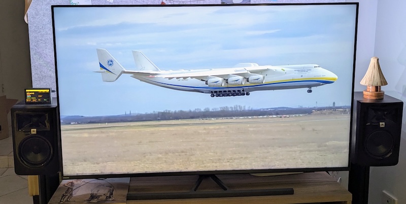 Foxtrot running in the lounge — tiny next to a wall-sized screen showing an Antonov An-225