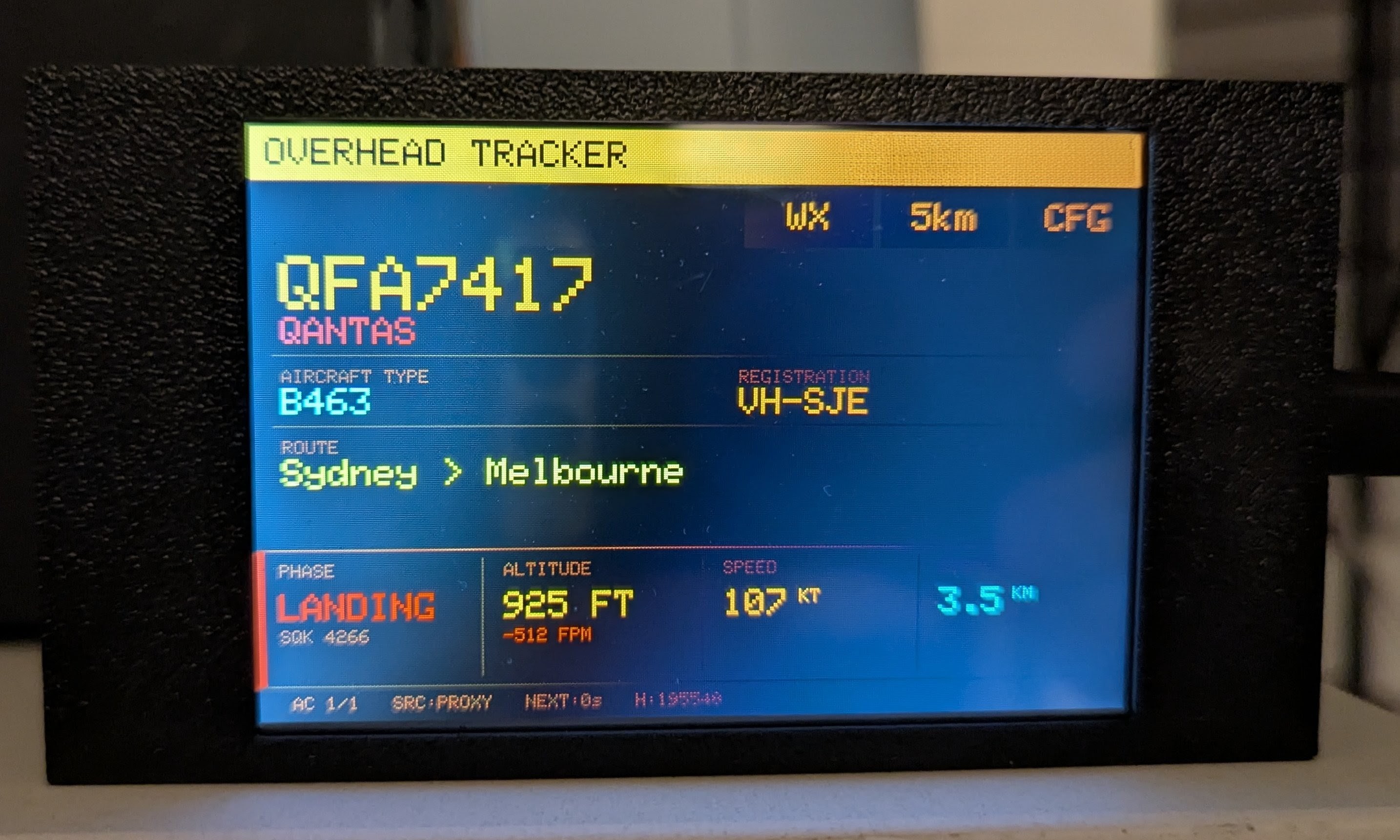 The ESP32 display showing a Qantas 737 on final approach into Sydney, 925 ft, 107 knots, 3.5 km out